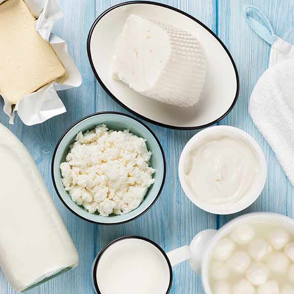 dairy products on wooden background sq