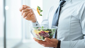 man eating salad