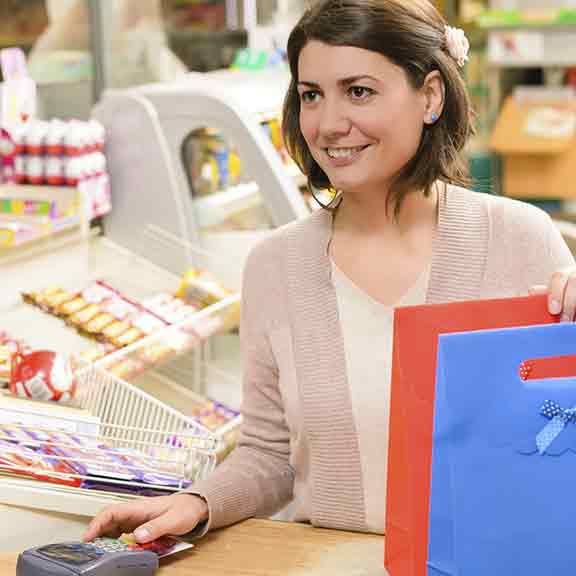 customer talks to shop assistant square