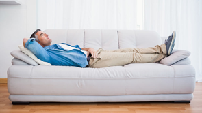 man lying on couch