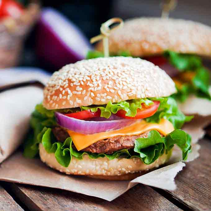 burger and fries on outdoor table square