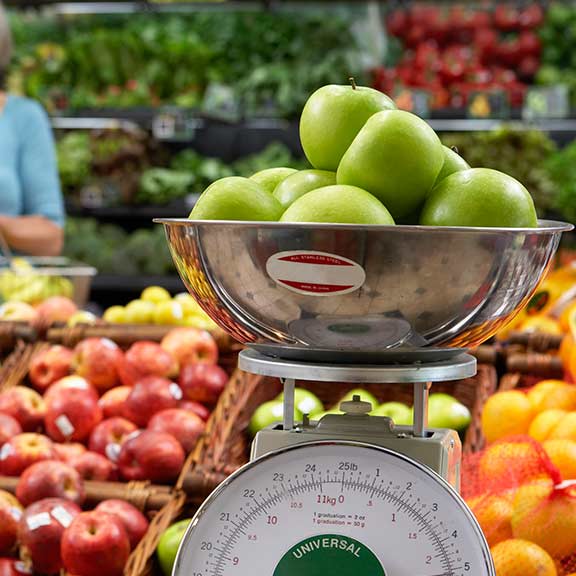 apples on scales at fruit and vegetable square