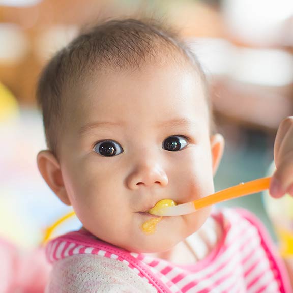 feeding baby with spoon sq