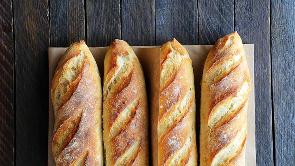 rolls of bread on dark background