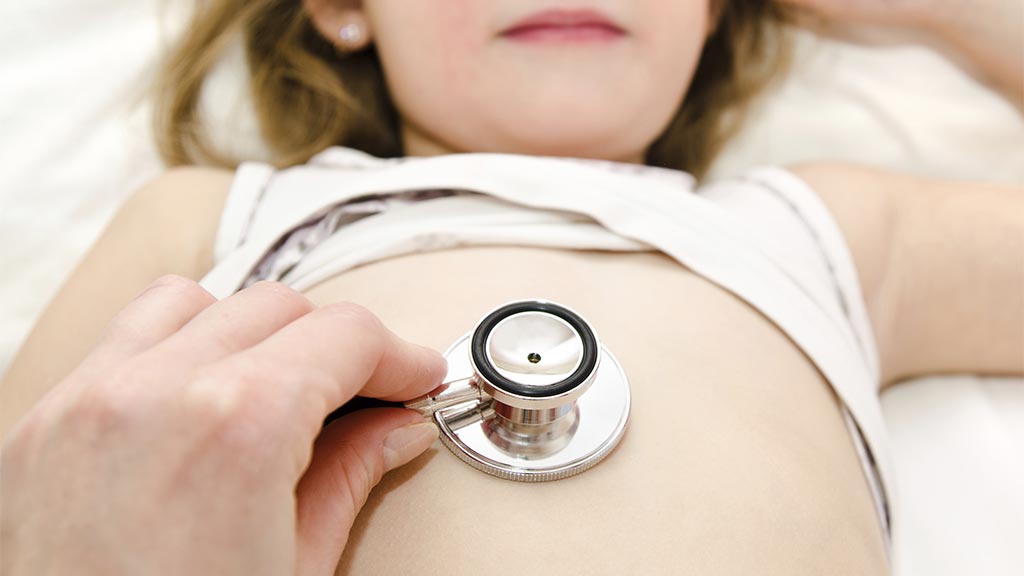 child being examined by a doctor