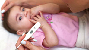 thermometer with baby in background